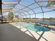 Inviting screened pool and spa with tranquil lake views at 4831 Boston Common Gln, Bradenton, FL 34211