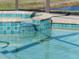 Spa with blue tile and waterfall feature at 4831 Boston Common Gln, Bradenton, FL 34211