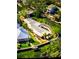 Stunning waterfront home with lush landscaping and a private dock, nestled along a picturesque canal at 4839 Primrose Path, Sarasota, FL 34242