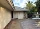Inviting front entrance with a decorative stone accent wall and courtyard at 4839 Primrose Path, Sarasota, FL 34242