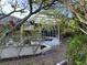Partially visible screened pool area with a pergola at 4839 Primrose Path, Sarasota, FL 34242