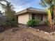 Landscaped side yard with a walkway and mature trees at 4839 Primrose Path, Sarasota, FL 34242