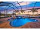 Relaxing pool and spa with screened enclosure at 4842 Pastel Ct, Sarasota, FL 34240