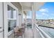 Relaxing balcony with water views and seating for two at 5325 Marina Dr # 333, Holmes Beach, FL 34217