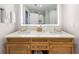 Double vanity bathroom with a large lit mirror at 5325 Marina Dr # 333, Holmes Beach, FL 34217