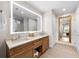 Double vanity bathroom with a large lit mirror at 5325 Marina Dr # 333, Holmes Beach, FL 34217