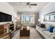 Bright living room with comfy seating, large TV, and access to balcony at 5325 Marina Dr # 333, Holmes Beach, FL 34217