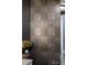 Bathroom with patterned wall tiles and dark wood accents at 540 N Tamiami Trl # 702, Sarasota, FL 34236
