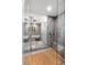 Spa-like bathroom with large shower, soaking tub, and tiled flooring at 540 N Tamiami Trl # 702, Sarasota, FL 34236