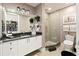 Modern bathroom with walk-in shower, granite vanity, and updated fixtures at 540 N Tamiami Trl # 702, Sarasota, FL 34236