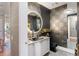 Stylish powder room with unique sink and patterned tile at 540 N Tamiami Trl # 702, Sarasota, FL 34236