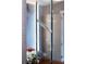 Close-up of a modern bathroom mirror with unique frame detail at 540 N Tamiami Trl # 702, Sarasota, FL 34236