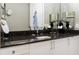 Bathroom with dark granite countertop and modern sink at 540 N Tamiami Trl # 702, Sarasota, FL 34236