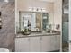 Elegant bathroom with double vanity, walk-in shower, and stylish decor at 540 N Tamiami Trl # 702, Sarasota, FL 34236