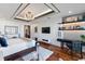 Main bedroom with a king-size bed, workstation, and hardwood floors at 540 N Tamiami Trl # 702, Sarasota, FL 34236