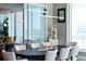 Elegant dining area with modern chandelier and city views at 540 N Tamiami Trl # 702, Sarasota, FL 34236
