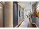 Modern hallway with hardwood floors and tasteful wall art at 540 N Tamiami Trl # 702, Sarasota, FL 34236