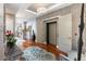Elegant hallway with hardwood floors and modern elevator access at 540 N Tamiami Trl # 702, Sarasota, FL 34236