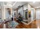 Light and airy hallway with hardwood floors and unique wall art at 540 N Tamiami Trl # 702, Sarasota, FL 34236