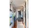 Bright hallway with hardwood floors and unique decor at 540 N Tamiami Trl # 702, Sarasota, FL 34236