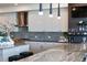 Sleek kitchen with white cabinets and granite countertops at 540 N Tamiami Trl # 702, Sarasota, FL 34236