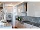 Modern kitchen with stainless steel appliances and granite countertops at 540 N Tamiami Trl # 702, Sarasota, FL 34236