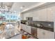 Modern kitchen with stainless steel appliances and granite countertops at 540 N Tamiami Trl # 702, Sarasota, FL 34236