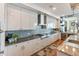 Modern kitchen with granite countertops, stainless steel appliances, and ample cabinetry at 540 N Tamiami Trl # 702, Sarasota, FL 34236