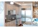 Modern kitchen with stainless steel appliances and granite countertops at 540 N Tamiami Trl # 702, Sarasota, FL 34236
