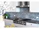 Modern gas cooktop with sleek stainless steel range hood at 540 N Tamiami Trl # 702, Sarasota, FL 34236
