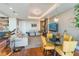 Bright living room features hardwood floors, stylish seating, and a dining area at 540 N Tamiami Trl # 702, Sarasota, FL 34236