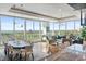 Spacious living area with hardwood floors,water views, and modern furniture at 540 N Tamiami Trl # 702, Sarasota, FL 34236