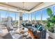 Living room with curved sofa and city views at 540 N Tamiami Trl # 702, Sarasota, FL 34236