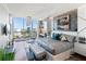 Elegant main bedroom features a large bed, hardwood floors, and city views at 540 N Tamiami Trl # 702, Sarasota, FL 34236