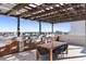 Rooftop outdoor kitchen with grill, seating area, and city views at 540 N Tamiami Trl # 702, Sarasota, FL 34236
