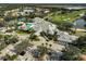 Clubhouse and parking area with surrounding golf course at 554 Fallbrook Dr, Venice, FL 34292