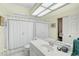 Clean bathroom with a single sink, shower, and toilet at 554 Fallbrook Dr, Venice, FL 34292