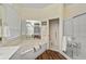 Large bathroom with a soaking tub, walk-in shower, and double vanity at 554 Fallbrook Dr, Venice, FL 34292