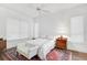 Spacious bedroom with a queen bed, ample closet space, and natural light at 554 Fallbrook Dr, Venice, FL 34292