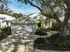 Single-story house with a two-car garage and landscaped yard at 554 Fallbrook Dr, Venice, FL 34292