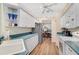 Well-equipped kitchen with white cabinets and teal countertops at 554 Fallbrook Dr, Venice, FL 34292