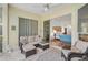 Relaxing sunroom featuring comfortable seating and views of the garden at 554 Fallbrook Dr, Venice, FL 34292