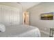 Serene bedroom with a comfortable bed and mounted TV at 5593 Piccolo St, Nokomis, FL 34275