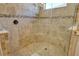 Large walk-in shower with tiled walls and built-in seat at 5593 Piccolo St, Nokomis, FL 34275