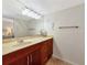 Clean bathroom with a vanity, mirror, and tiled floors at 6157 Midnight Pass Rd # E43, Sarasota, FL 34242