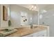 Bathroom with a large mirror, double vanity, and a walk-in shower at 634 Key Royale Dr, Holmes Beach, FL 34217