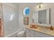 Clean bathroom with a tub, sink and vanity at 634 Key Royale Dr, Holmes Beach, FL 34217