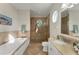 Spa-like bathroom with soaking tub and shower at 634 Key Royale Dr, Holmes Beach, FL 34217