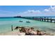 Kayakers by a pier on a clear sunny day at 634 Key Royale Dr, Holmes Beach, FL 34217