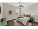 Bedroom with a queen bed, hardwood floors, and ceiling fan at 634 Key Royale Dr, Holmes Beach, FL 34217